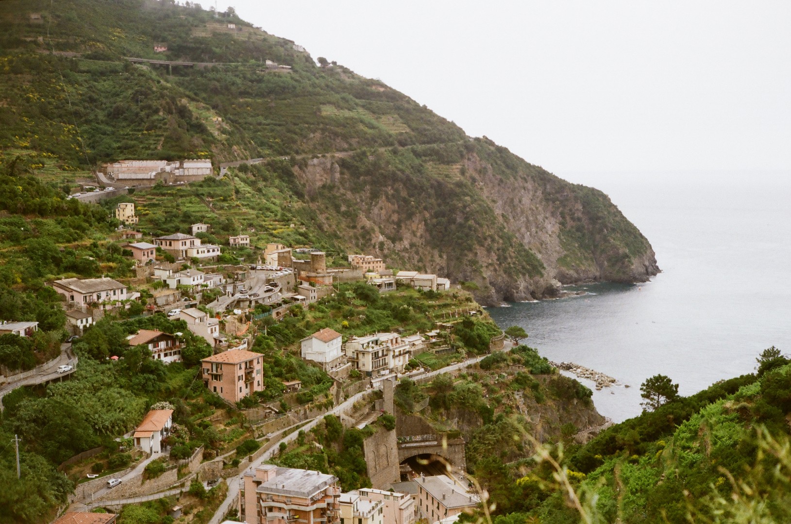 Looking back towards Riomaggiore while trekking through the hills.