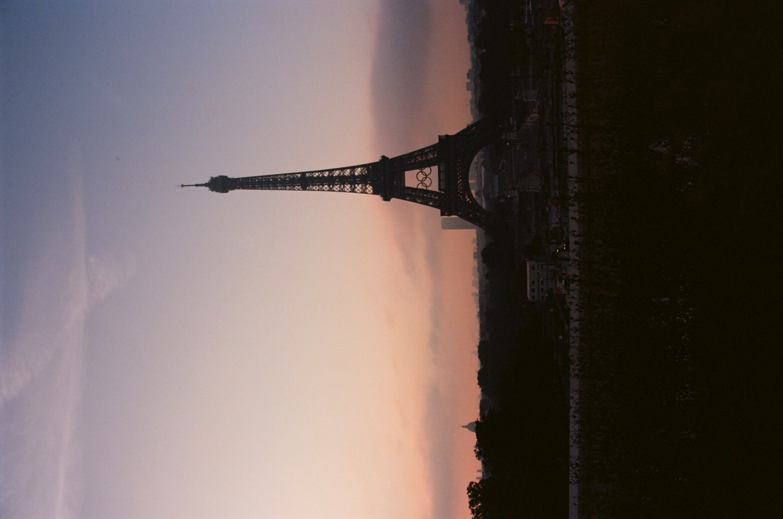 A sunrise Eiffel Tower, complete with Olympic rings. 