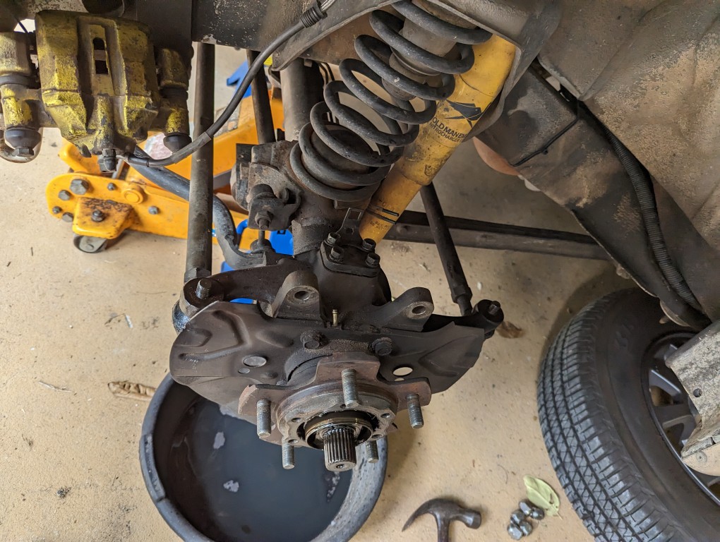 Replacing the bearings and seals in the swivel hubs.